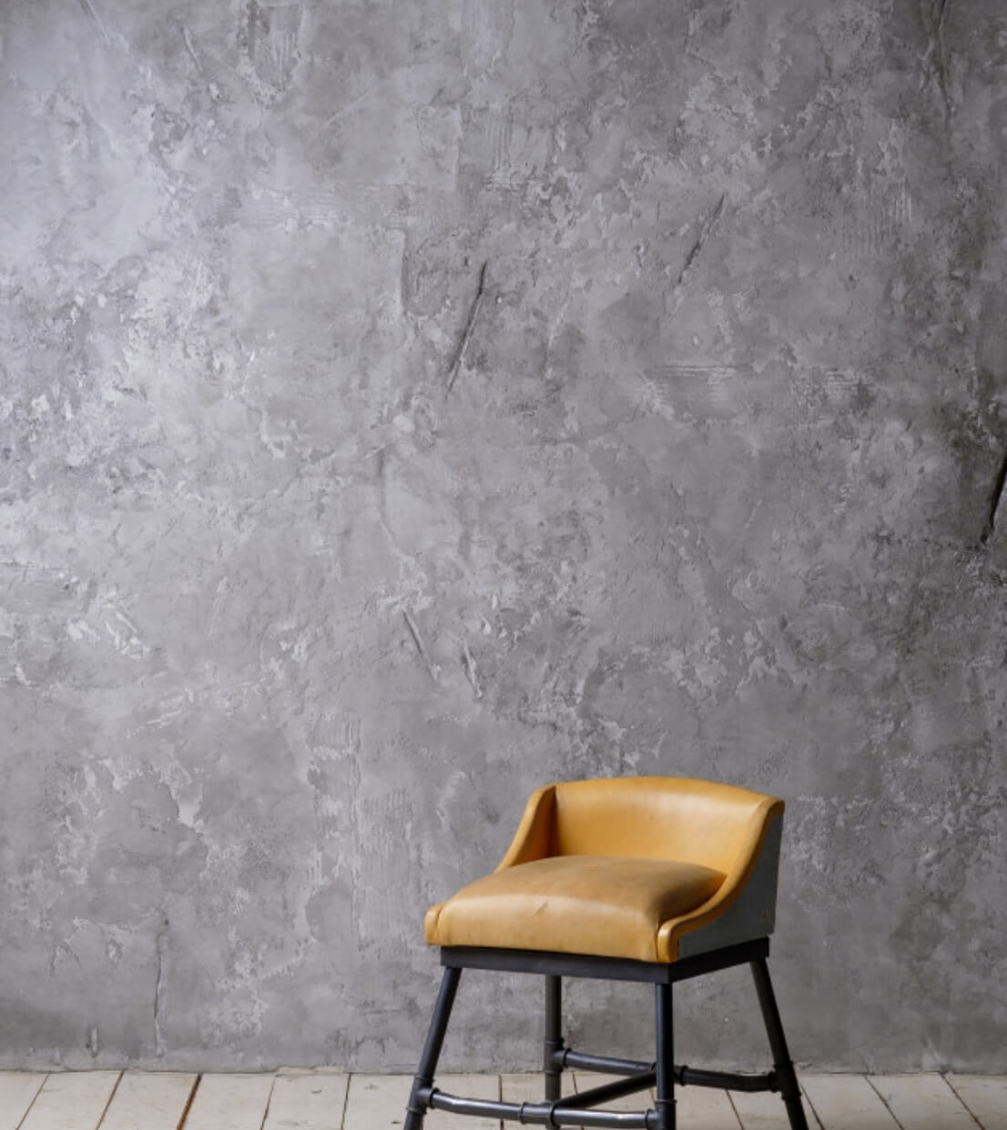 vintage loft interior with wooden floor textured aged grey concrete wall chair_76562 32@2x