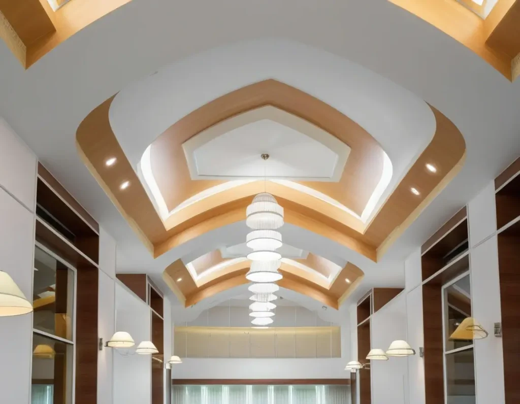 A dual-tone false ceiling design with distinct layers and modern lighting fixtures